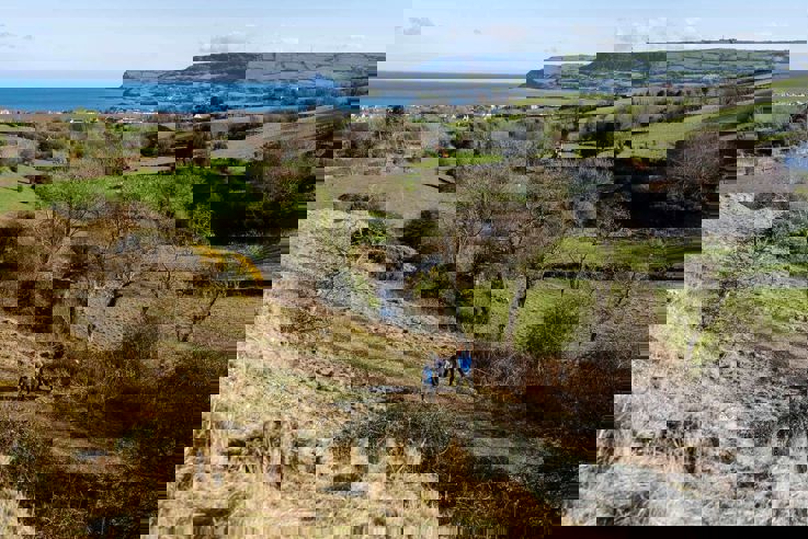 Hikers walking Carnlough Hill 